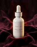 Serelise Snail Mucin Face Serum on burgundy velvet